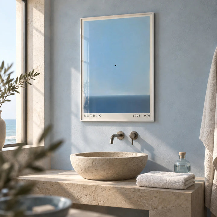 Blue Wall Art, framed on the wall of a calm bathroom with a pale blue plaster wall and a plain stone basin