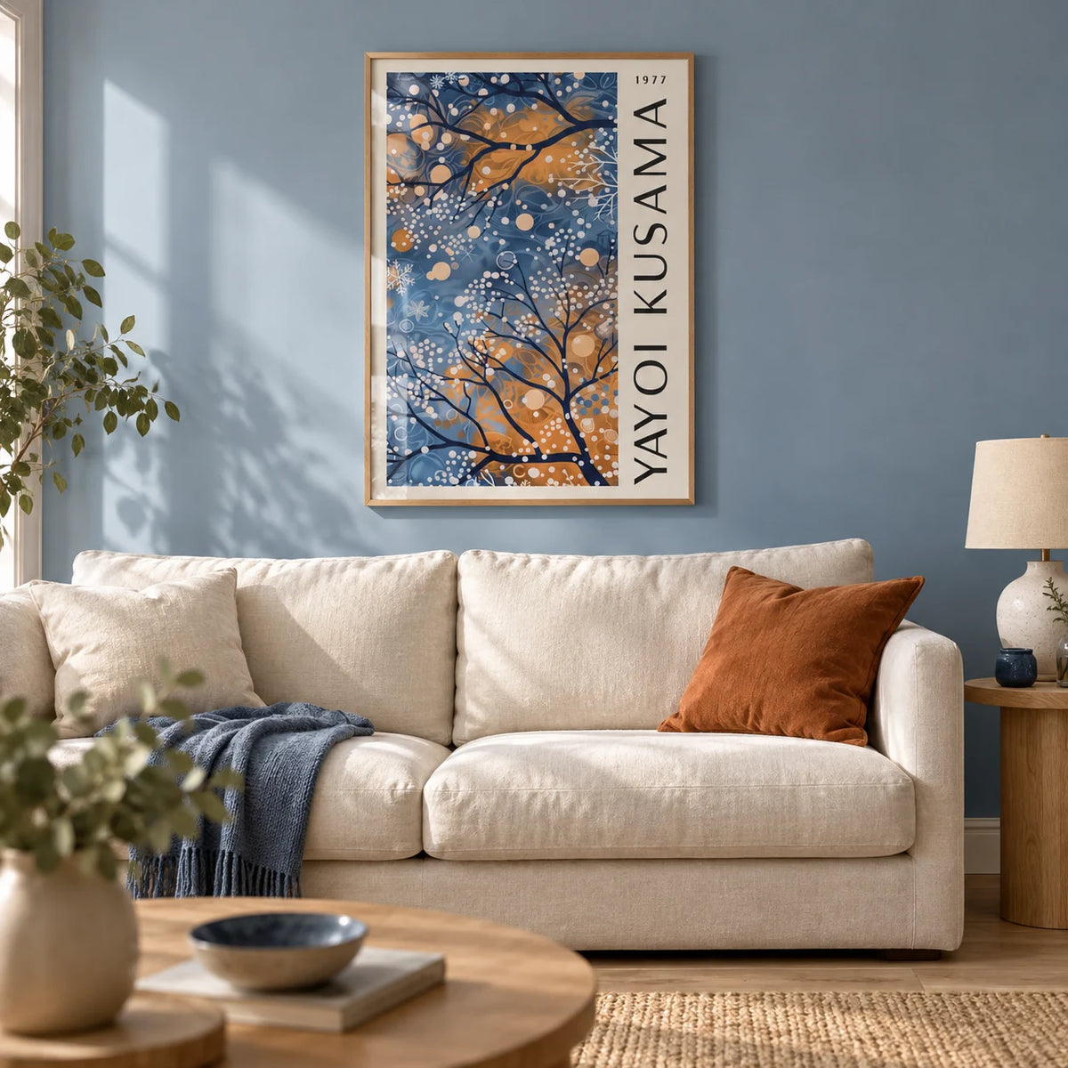 Blue Wall Art for Living Room, framed on the wall of a calm living room with a soft blue painted wall and a pale oak floor