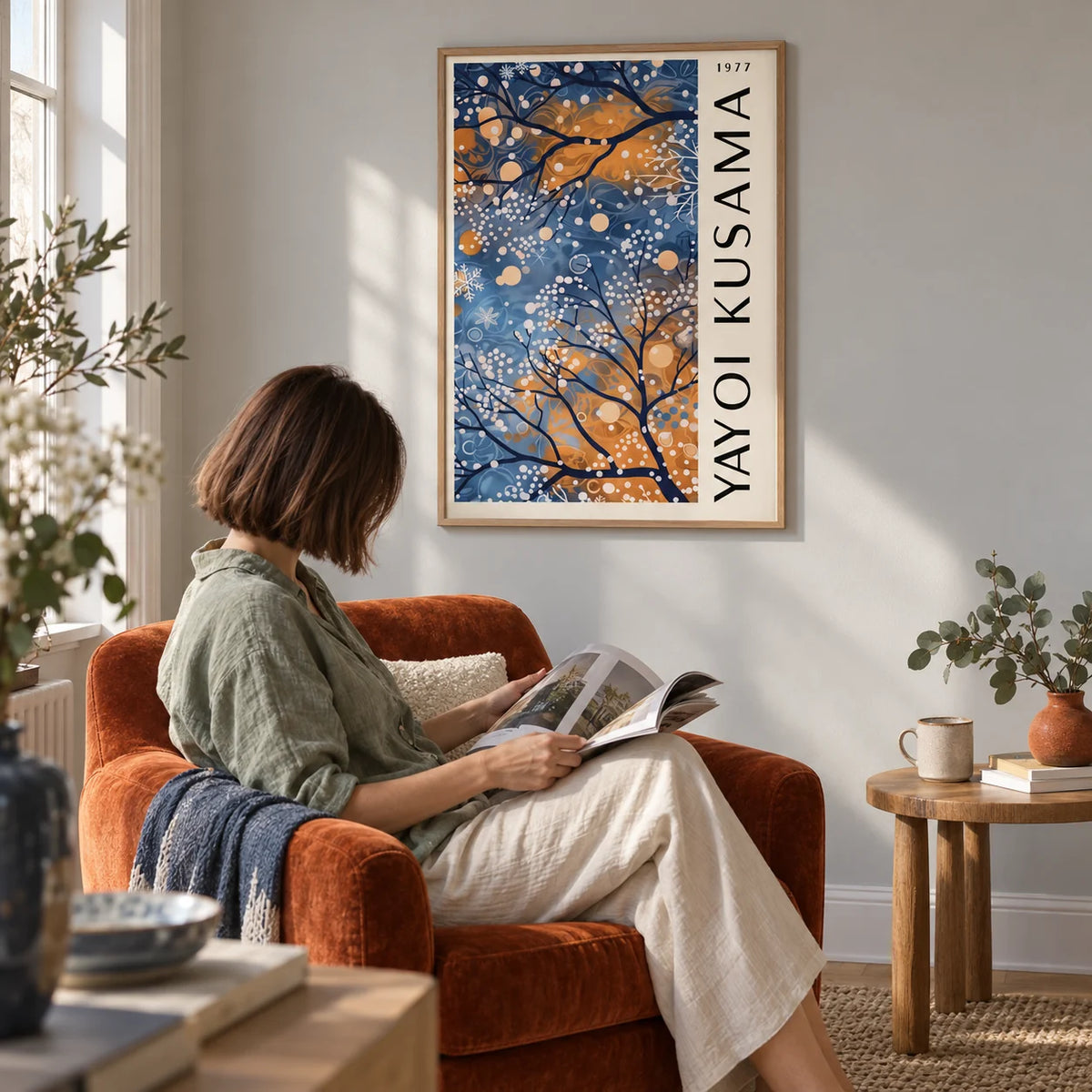 Blue Wall Art for Living Room, framed on the wall of a reading corner with a pale grey wall