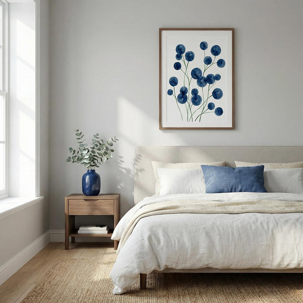 Bedroom with a bed, nightstand, and wall art featuring blue flowers.