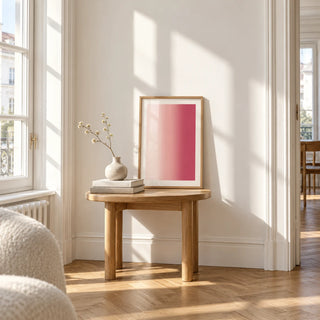 Blush Pink Wall Art, a small A4 framed print leaning on a small solid oak side table