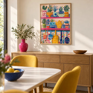 Boho Kitchen Print, framed on the wall of a cheerful dining room with a plain cream wall