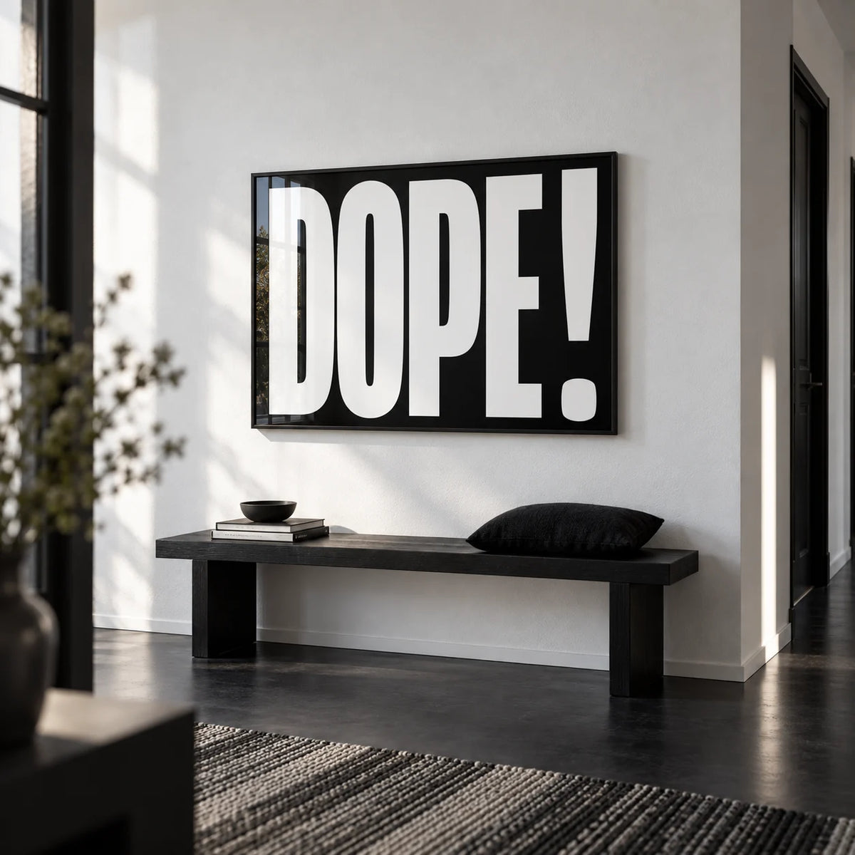 Bold Font Poster, framed on the wall of a monochrome hallway with a white wall and a black floor