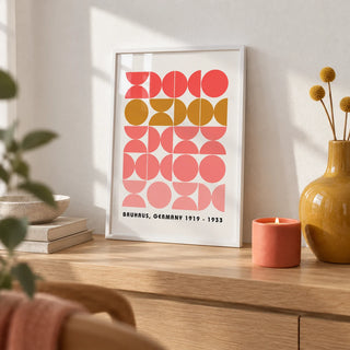 Bold MCM Wall Art, a small A4 framed print leaning on a pale oak shelf in a living room