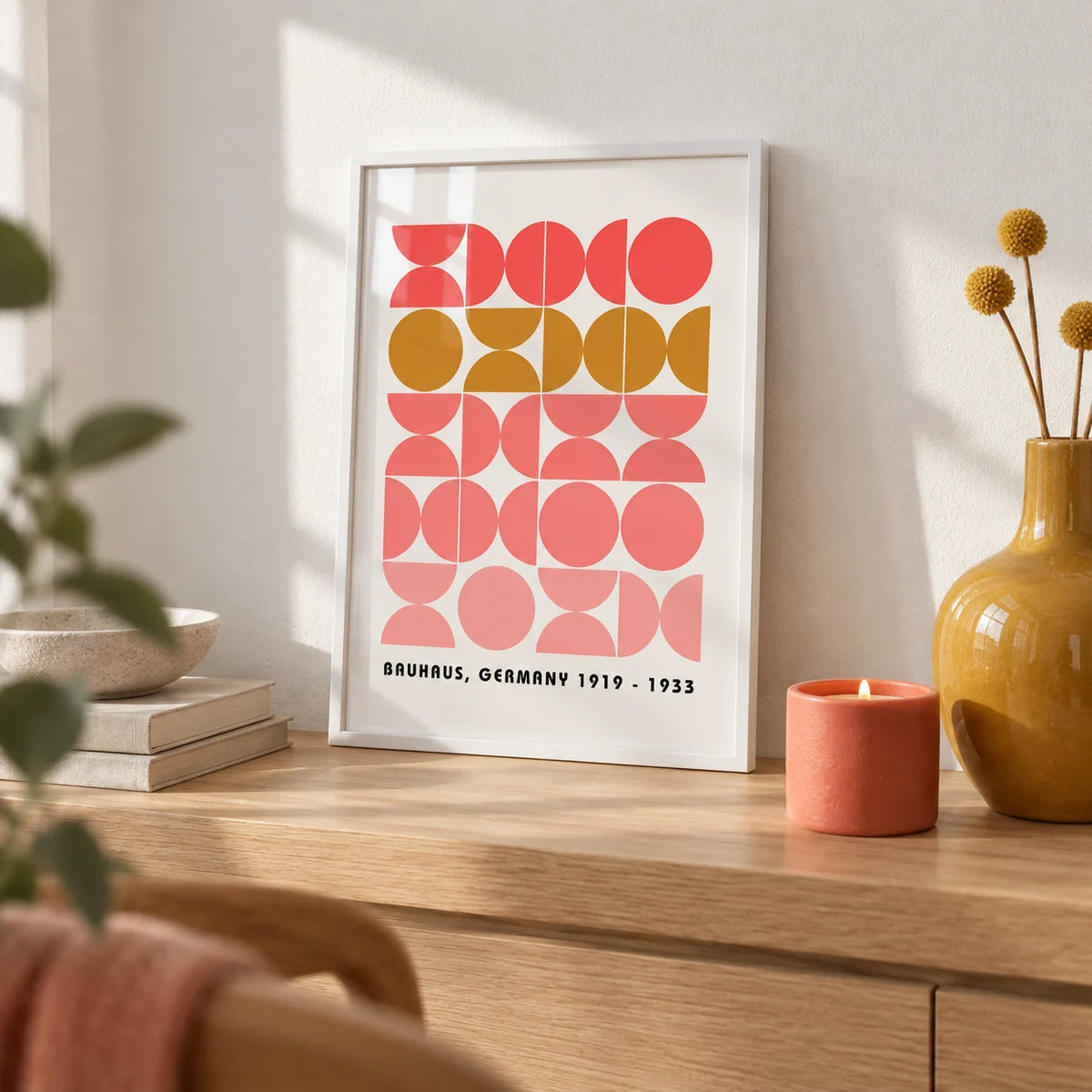 Bold MCM Wall Art, a small A4 framed print leaning on a pale oak shelf in a living room