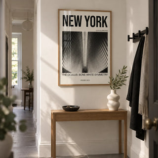 Bone White Architecture Print, framed on the wall of a narrow hallway in a renovated Victorian terrace with bone-white walls and large plain grey floor tiles
