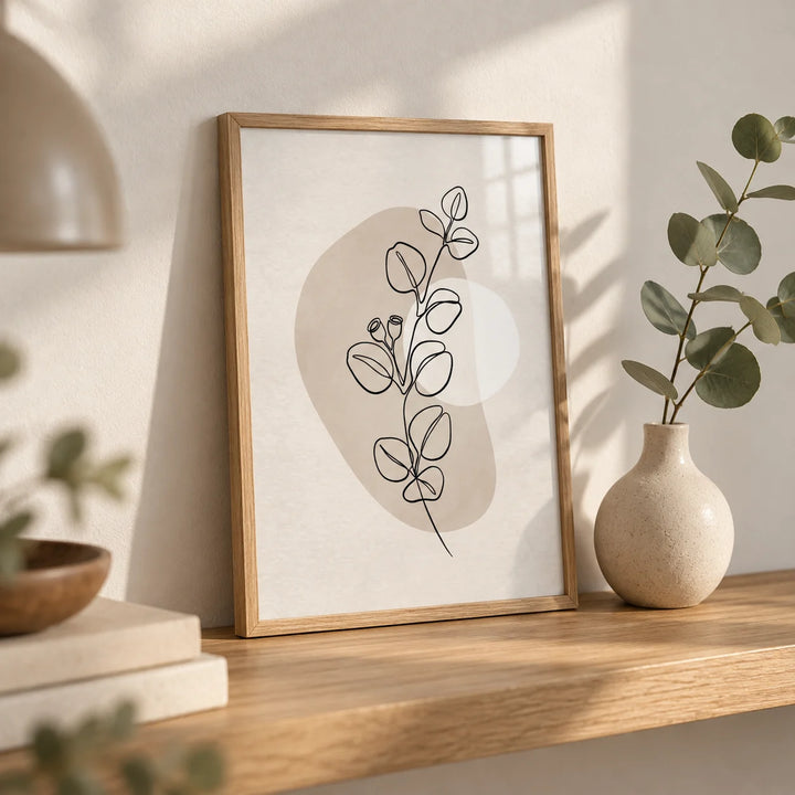 Botanical Line Art Print, a small A4 framed print leaning on an oak shelf in a living room