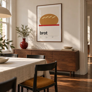 Bread Poster, framed on the wall of a design-led dining room in a renovated UK terrace with warm white walls and a walnut floor