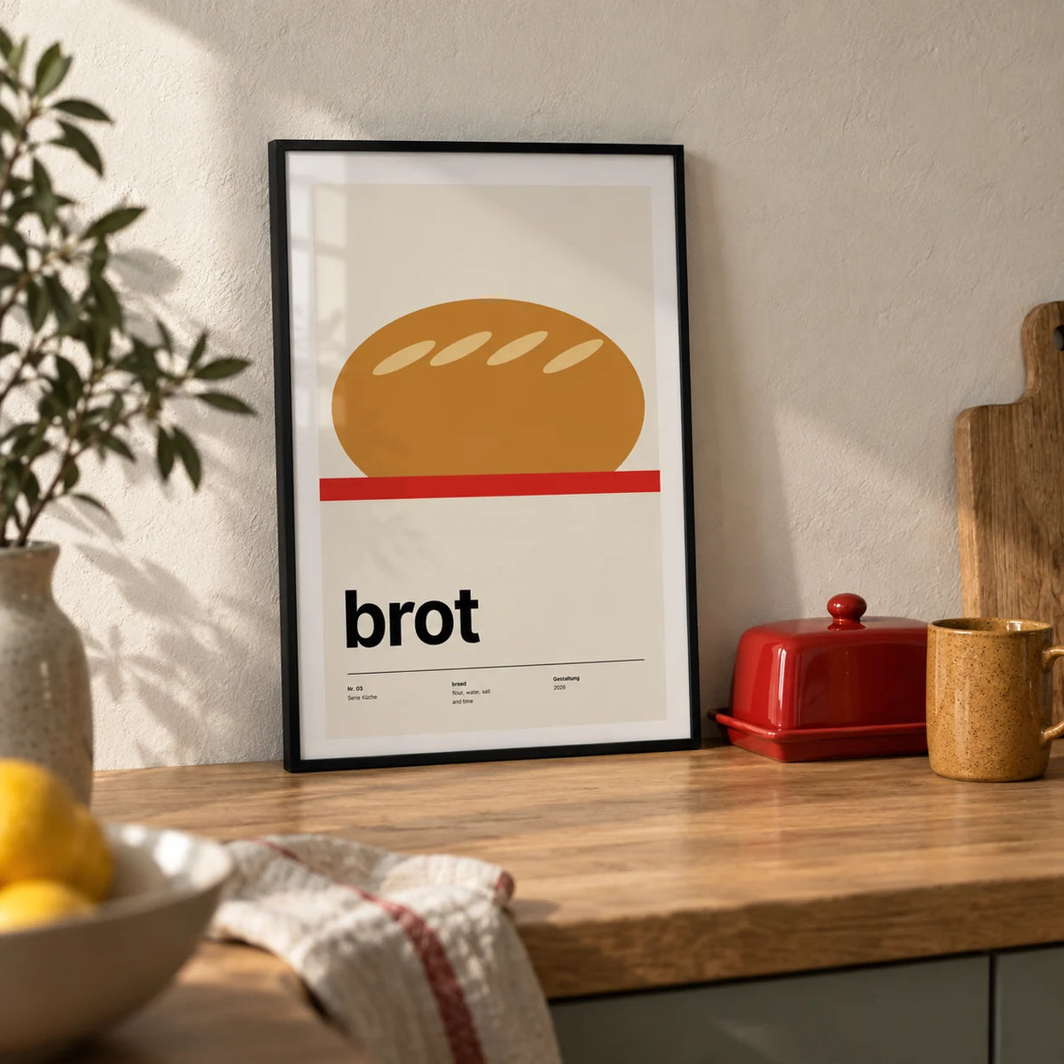 Bread Poster, a small A4 framed print leaning on an oak kitchen worktop
