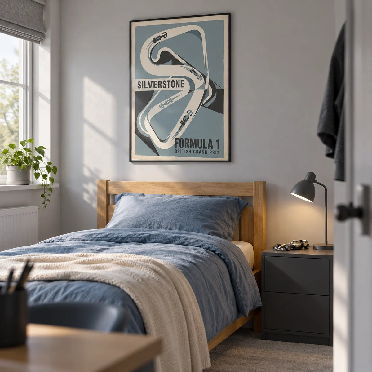 British Race Track Map Poster, framed on the wall of a tidy teenage racing fan's single bedroom (13-17) in a British family home with a pale grey wall