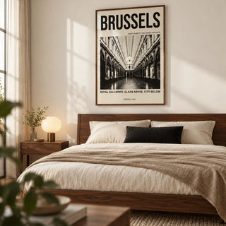 Brussels Gallery Print, framed on the wall of a restrained modern bedroom for an architecture-loving couple with a warm white wall and walnut furniture