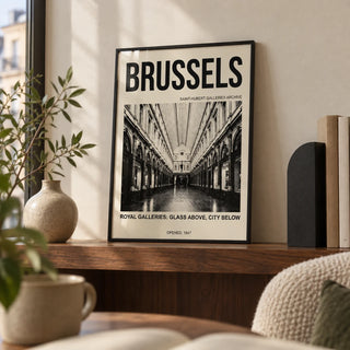 Brussels Gallery Print, a small A4 framed print leaning on a walnut shelf in a living room