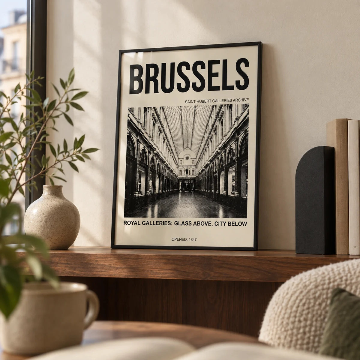 Brussels Gallery Print, a small A4 framed print leaning on a walnut shelf in a living room
