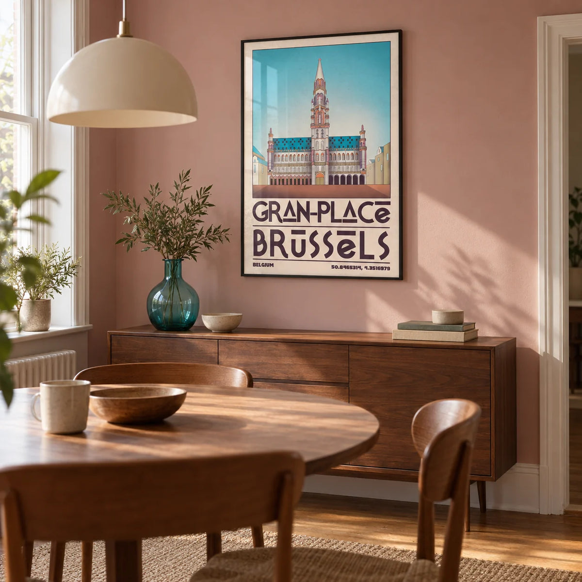 Brussels Grand Place Art Print, framed on the wall of a modest dining room in a UK terrace with a muted dusty pink wall and warm timber flooring