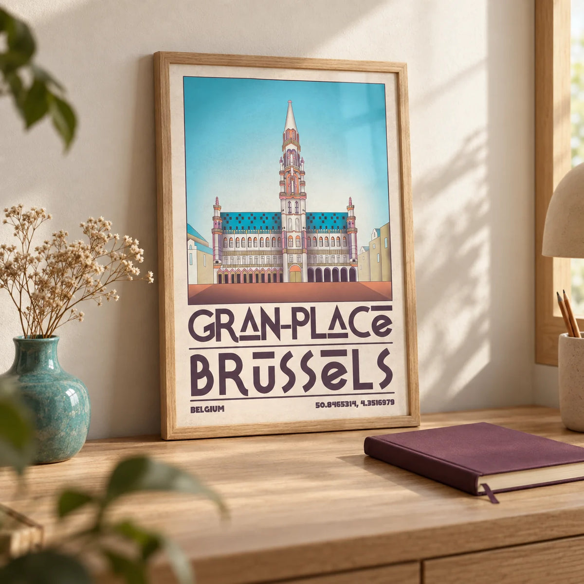 Brussels Grand Place Art Print, a small A4 framed print leaning on a pale oak desk