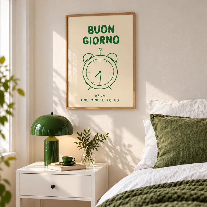 Buongiorno Print, framed on the wall of a bedroom above a bedside table with a green lamp