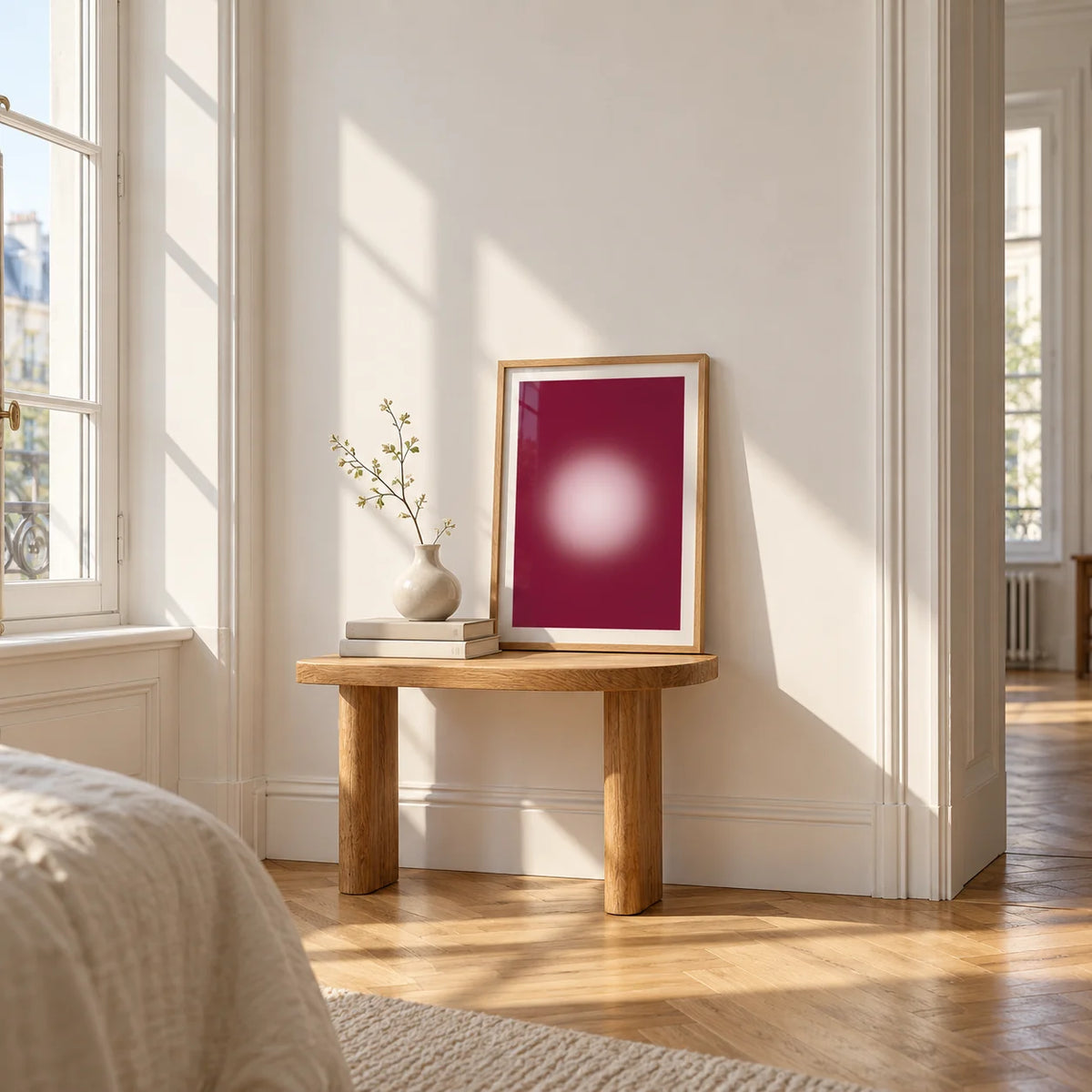 Burgundy Aura Print, a small A4 framed print leaning on a small solid oak side table