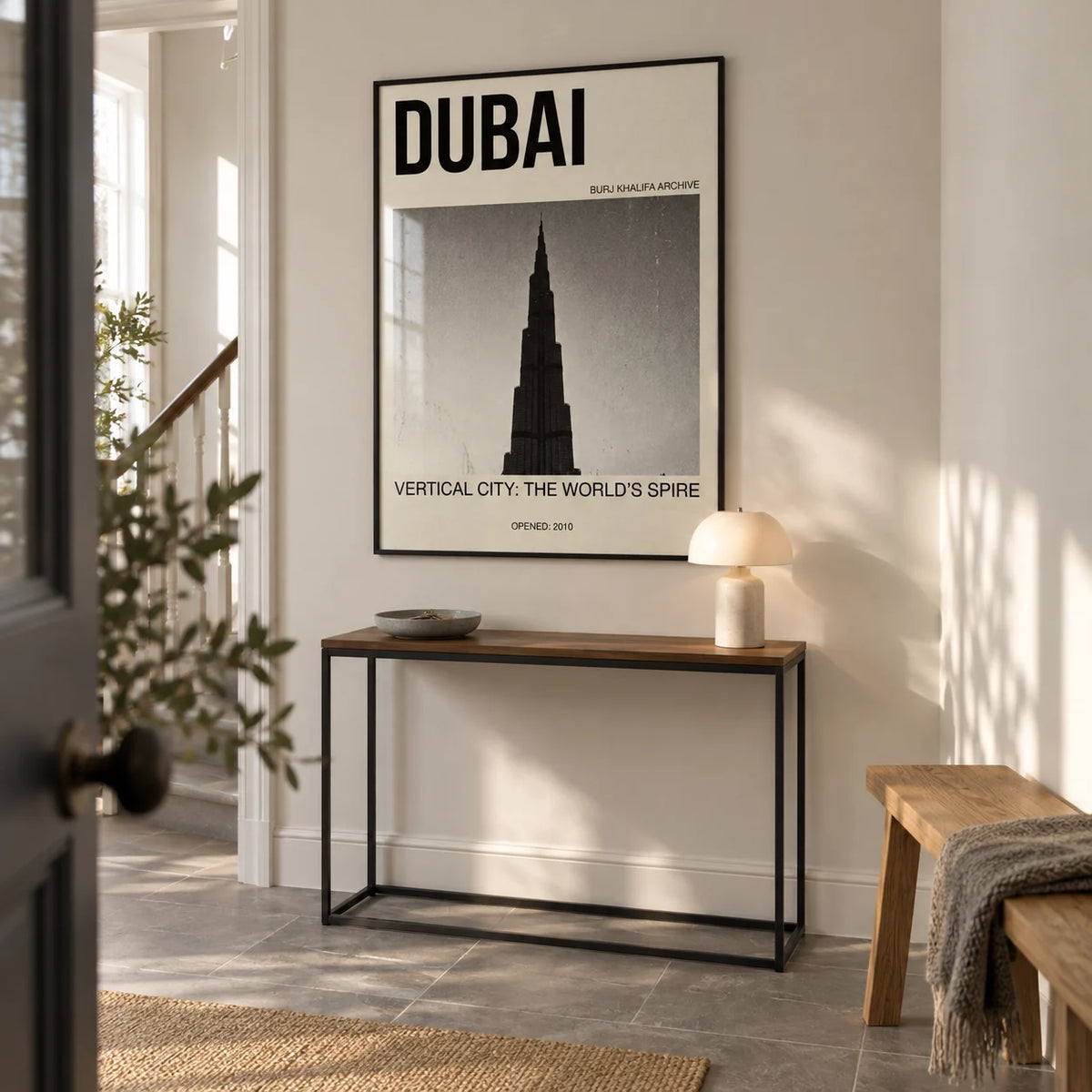 Burj Khalifa Art Print, framed on the wall of a crisp entrance hallway in a renovated UK terrace with ivory walls and a plain grey stone floor