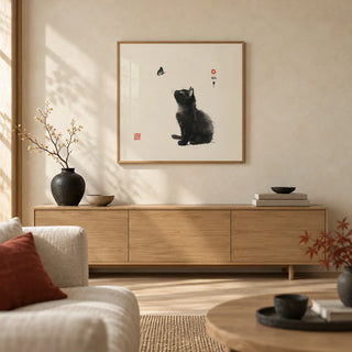 Butterfly Cat Poster, framed on the wall of a calm Japandi living room with a warm cream limewashed wall and a pale oak floor