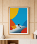 Along a sweeping curve, modern wall art print depicts a single cyclist with graphic shadow and overlapping shapes