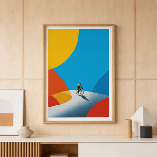 Along a sweeping curve, modern wall art print depicts a single cyclist with graphic shadow and overlapping shapes