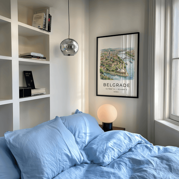 Multicolored cityscape print highlighting arched bridge spans at sunset