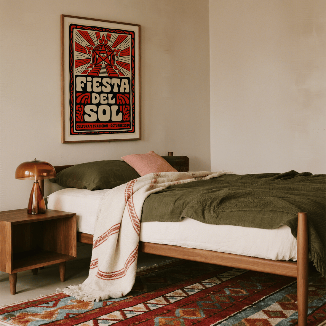 Bedroom with cream walls, olive green bedding, a patterned red rug and a red and cream folk-style sun poster above a wooden bed