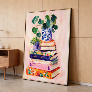 Painterly wall art featuring a book stack with a plant pot and patterned vase