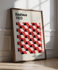 Bauhaus pictures with red and black triangle pattern on cream background.