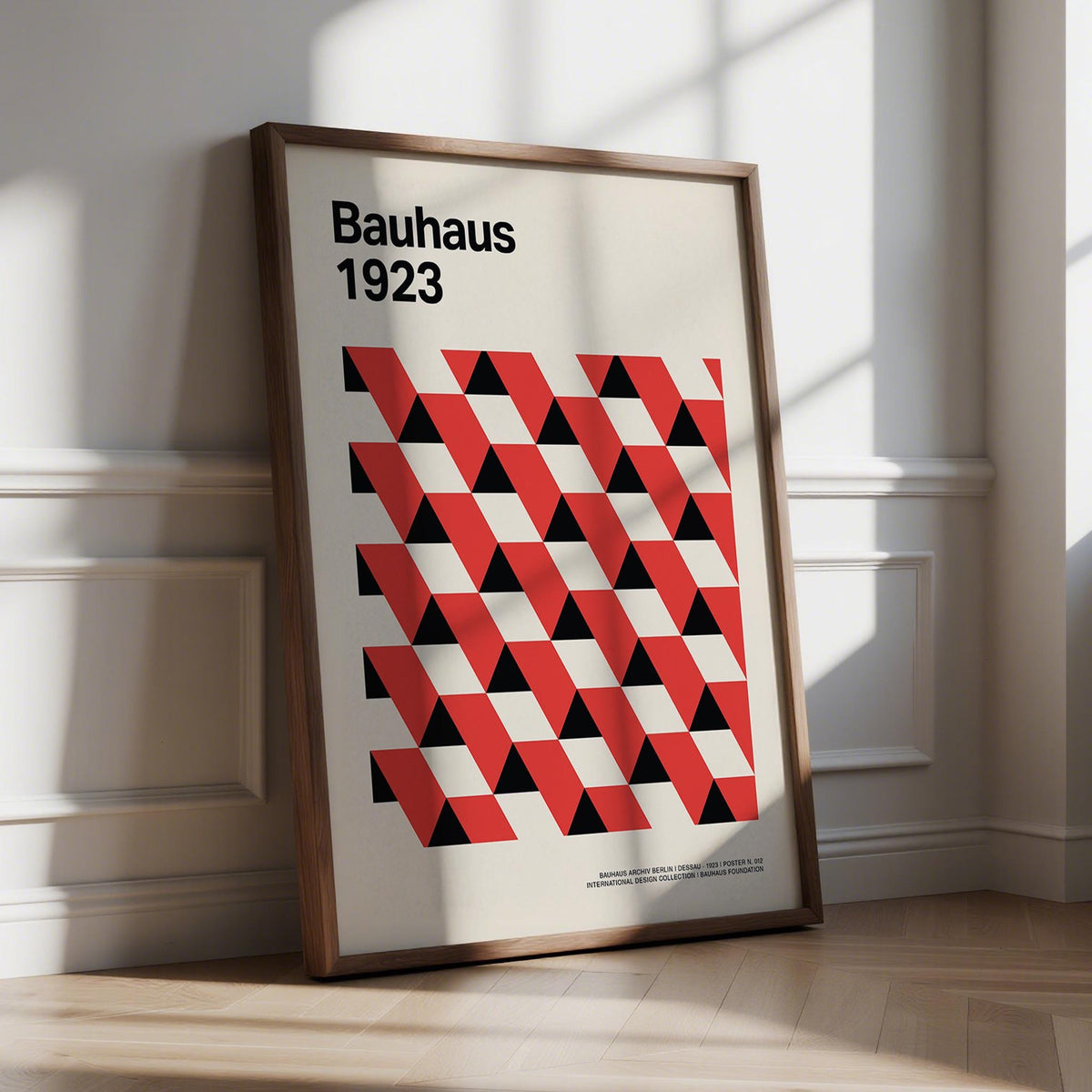 Bauhaus pictures with red and black triangle pattern on cream background.