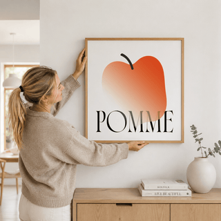 Minimalist Apple Art Print poster hung above dining table