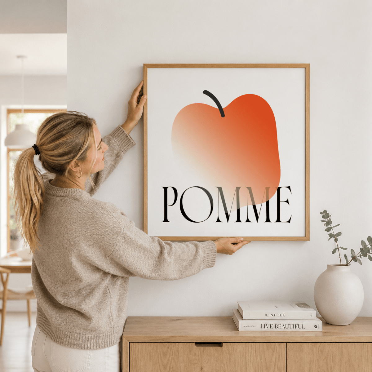 Minimalist Apple Art Print poster hung above dining table