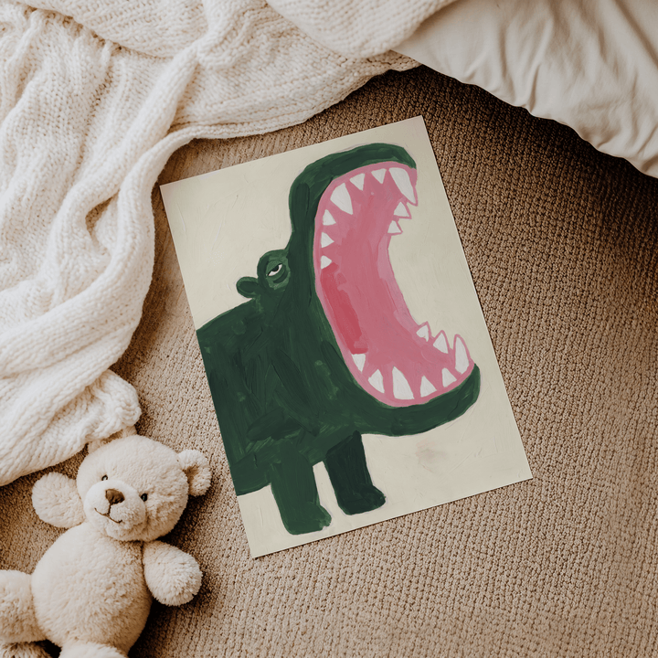 Roaring hippopotamus illustration in green and pink lying on a carpet near a teddy bear