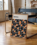 Abstract poster featuring a modern Bauhaus pattern in black and orange.
