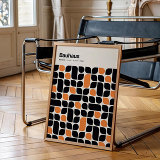 Abstract poster featuring a modern Bauhaus pattern in black and orange.