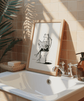 Humorous wall art print showing a cartoon frog on a toilet with legs crossed