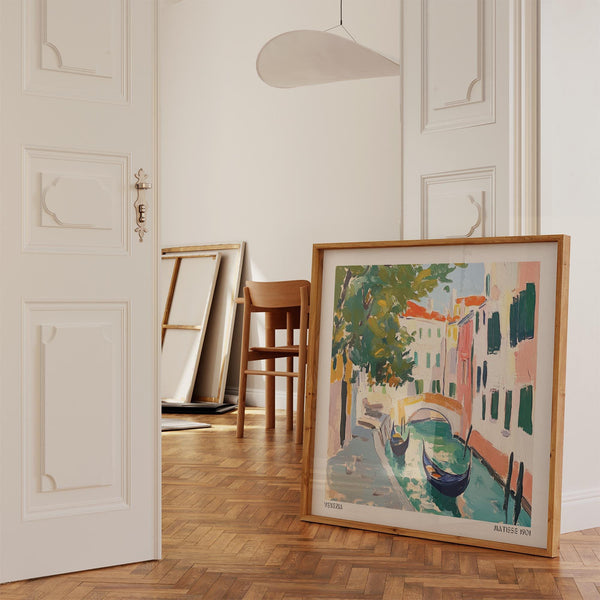Sunlit street scene with water reflections in our Venice Wall Art collection.