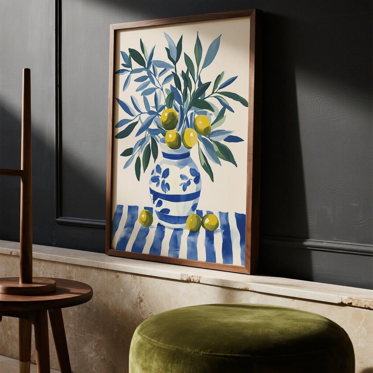 Blue and green olive tree wall art with fruit-filled branches in a vase.