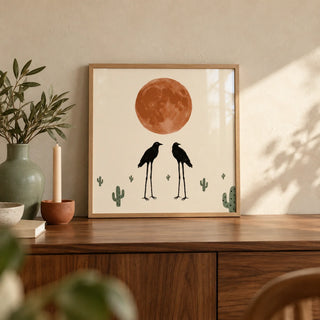 Cactus Bird Wall Art, a small A4 framed print leaning on a walnut sideboard in a living room