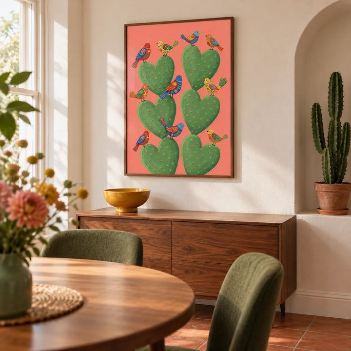 Cactus Heart Poster, framed on the wall of a compact dining room in a UK terrace with warm white walls and a shallow arched niche