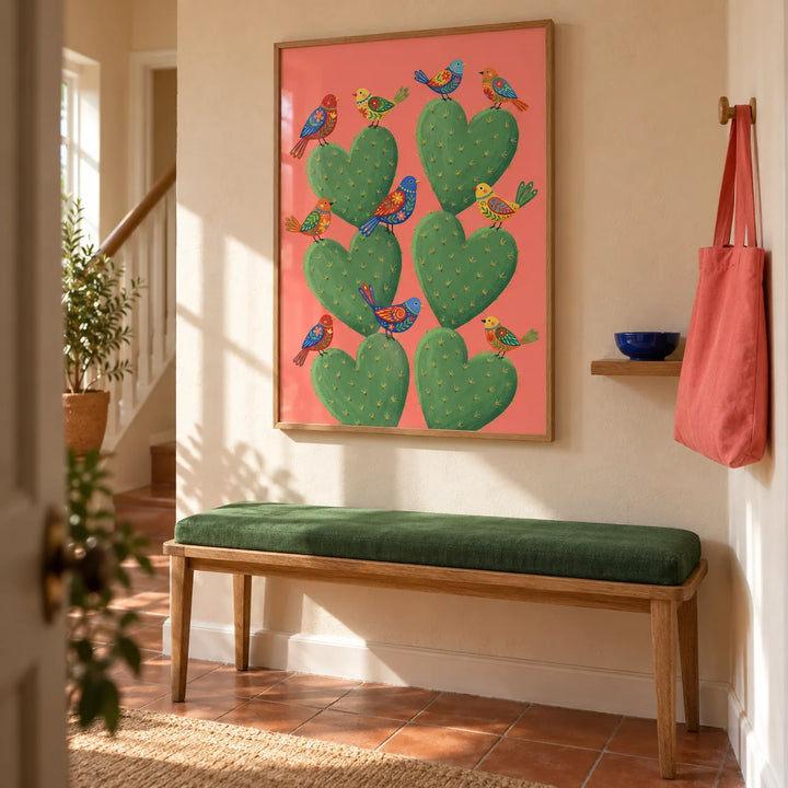 Cactus Heart Poster, framed on the wall of a welcoming hallway in a UK terraced home with pale warm plaster walls and plain terracotta floor tiles