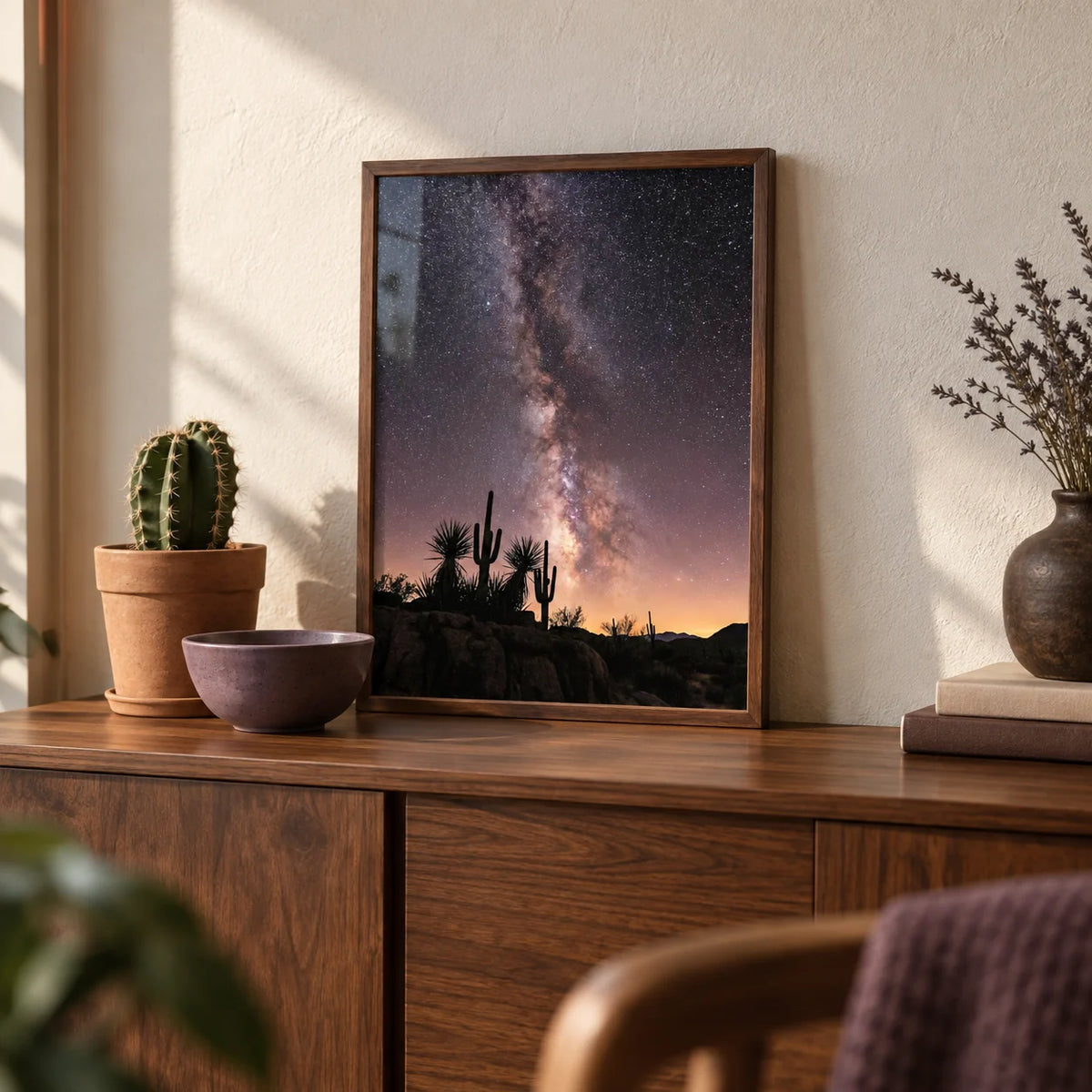 Cactus Night Print, a small A4 framed print leaning on a walnut sideboard in a living room
