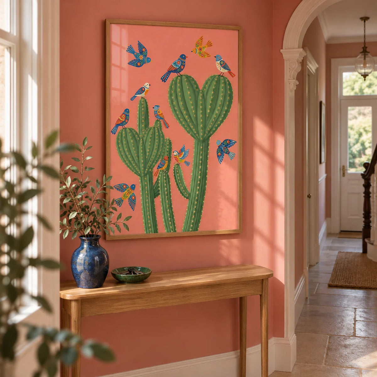 Cactus Poster Print, framed on the wall of a bright narrow hallway in a Victorian terrace with muted coral pink walls and plain pale stone floor tiles