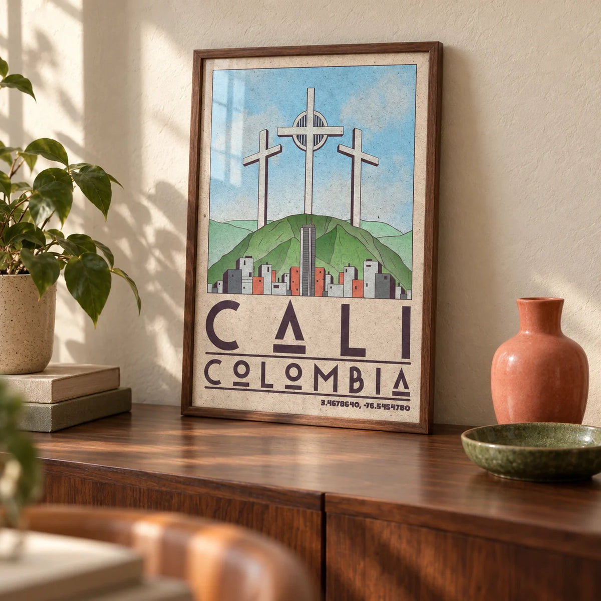 Cali Colombia Art Print, a small A4 framed print leaning on a walnut sideboard in a living room