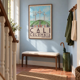 Cali Colombia Art Print, framed on the wall of a welcoming narrow hallway in a UK terraced house with pale blue walls and warm terracotta floor tiles laid in a plain grid