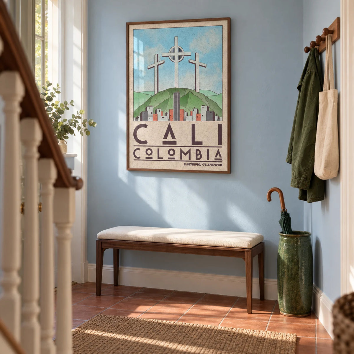 Cali Colombia Art Print, framed on the wall of a welcoming narrow hallway in a UK terraced house with pale blue walls and warm terracotta floor tiles laid in a plain grid