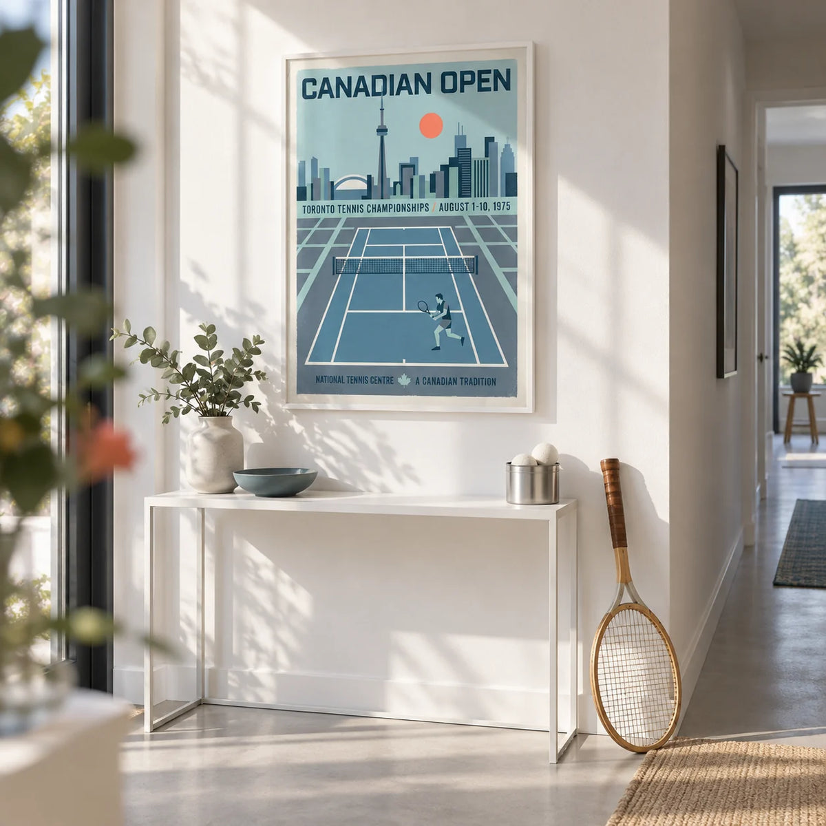 Canadian Open Tennis Art Print, framed on the wall of a bright hallway with a white wall and a pale grey floor