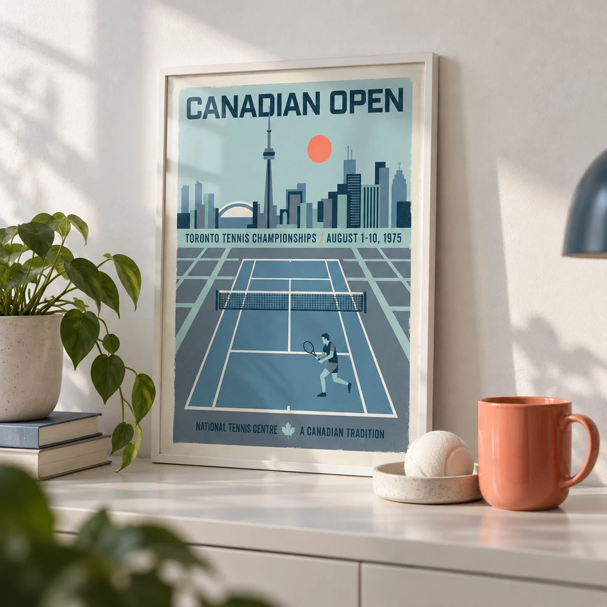 Canadian Open Tennis Art Print, a small A4 framed print leaning on a white shelf in a living room