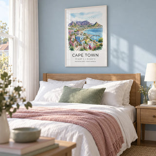 Cape Town Art Print, framed on the wall of a calm coastal bedroom in a UK semi-detached home with a pale blue wall and white cotton curtains