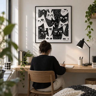 Cat Art Black and White, framed on the wall of a compact creative study in a first flat (22-28) with a white wall and a built-in oak desk